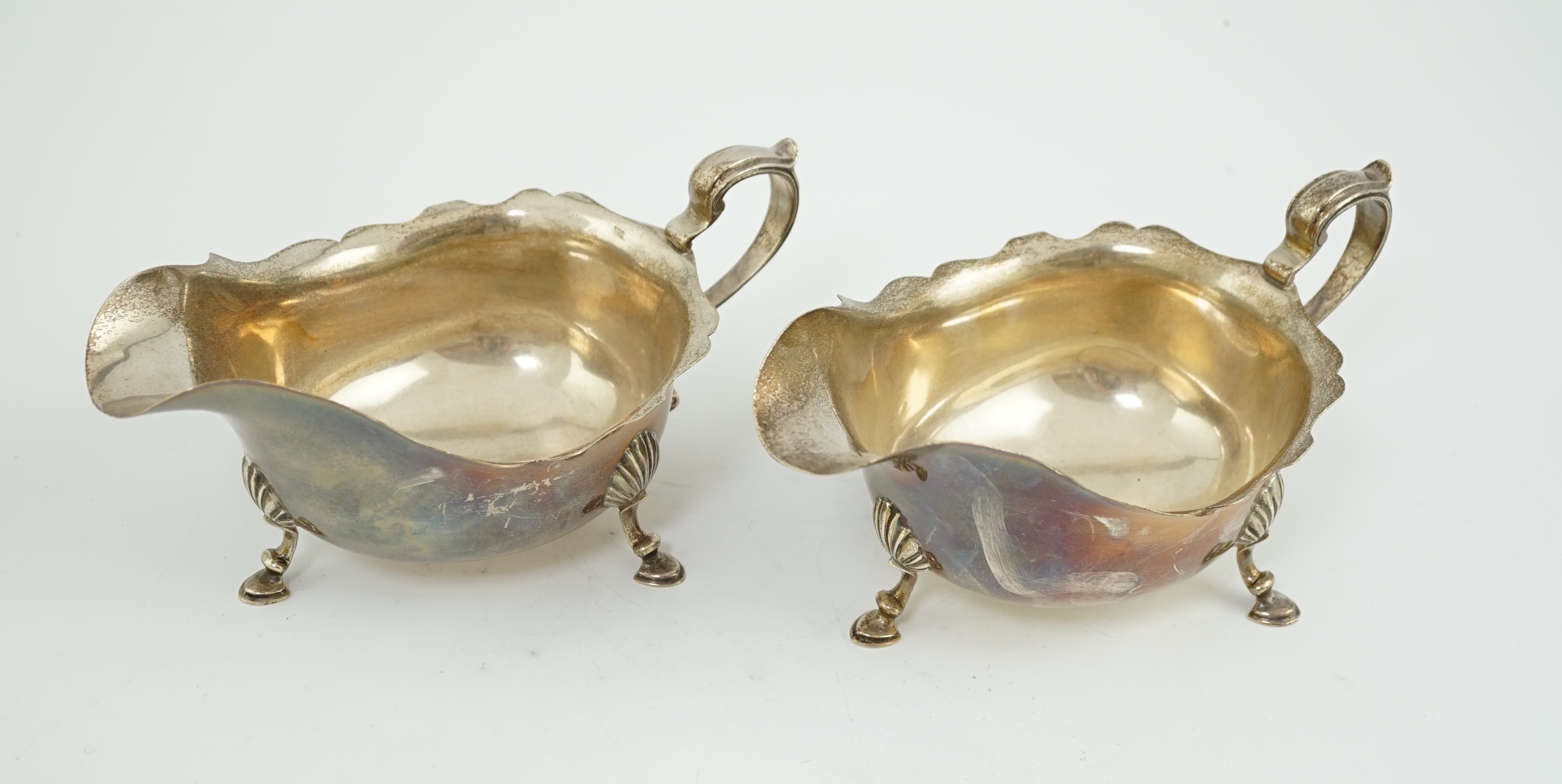 A pair of Elizabeth II silver sauce boats, maker A over HA